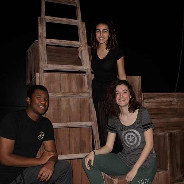 Jonathan Middleton (Peter Pan), Isabell Orahar (Molly), and Viviana McCormick (Black Stache) sit on the set of Peter and the Starcatcher after performing on a Friday night. Mar. 9, 2018. The Telescope / Jennesh Agagas