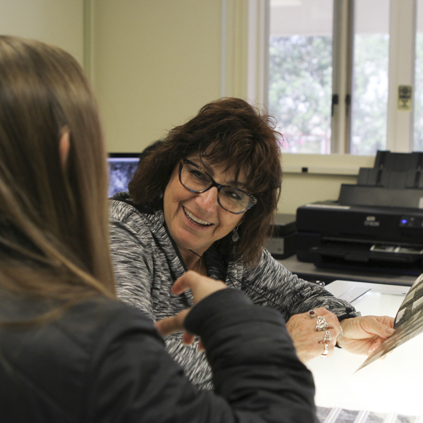 Photography Professor Donna Cosentino helps student Alexis Metz during Photo 124, Intro to film for digital photographers, May 2, 2018. (Aubree Wiedmaier/ The Telescope)