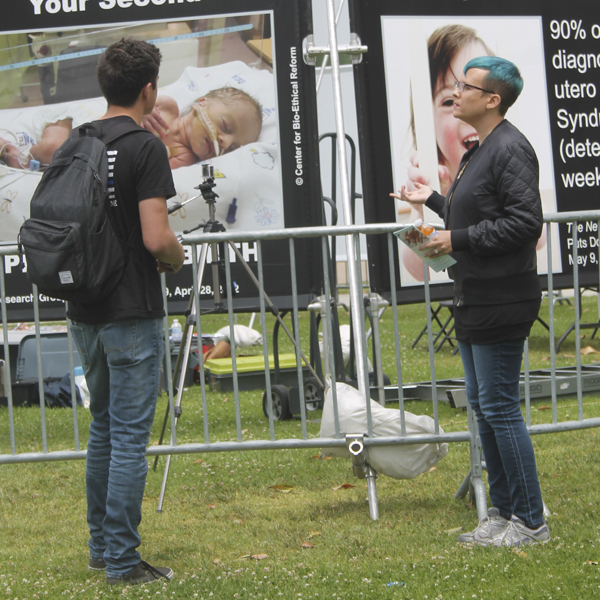 Member of The Center for Bioethical Reform interacts with a Palomar College Student, promoting pro life on April 30, 2018. (Susanna Behnan/The Telescope)