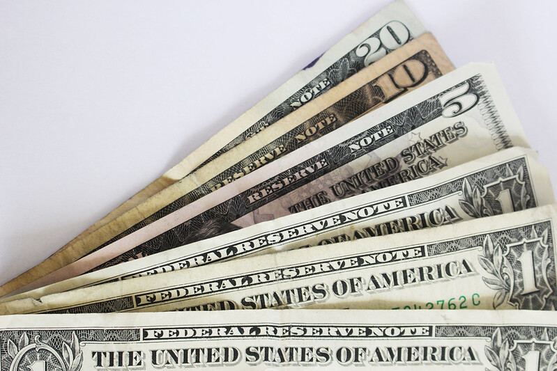 Six U.S. bills: 1 $20, 1 $10, 1 $5, and 3 $1.