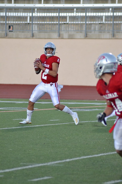 Comet Quarterback Rodney Thompson rolls out to his right against Moorpark. (Krista Moore/ The Telescope)