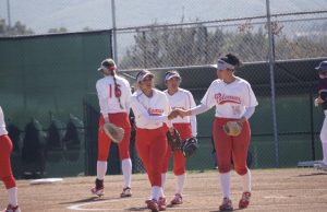 Samarah Martinez (on the left) shakes teammates hand as she heads onto the field. Photo provided by Samarah Martinez.