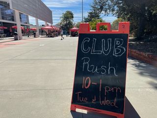 A sign sits outside near Palomar's cafeteria that says, "Club Rush 10-1pm Tue & Wed."