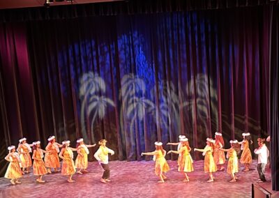 Dancers in tribal wear performing on stage