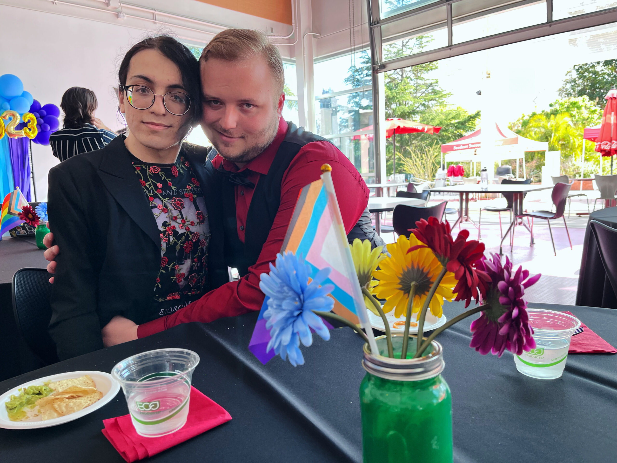 Brendan Kempka (left) and his boyfriend, Jacob Miller (right), sitting together at the queer prom.
