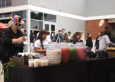 Palomar community help themselves to refreshments at the Palomar Queer Pride Event May 10 2023
