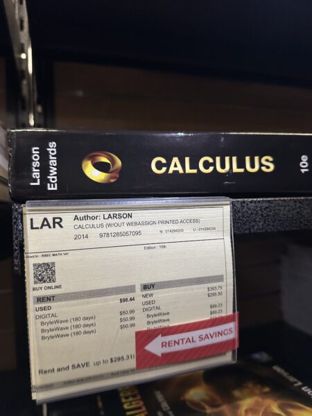 Calculus textbook on shelf with rent and buying prices.
