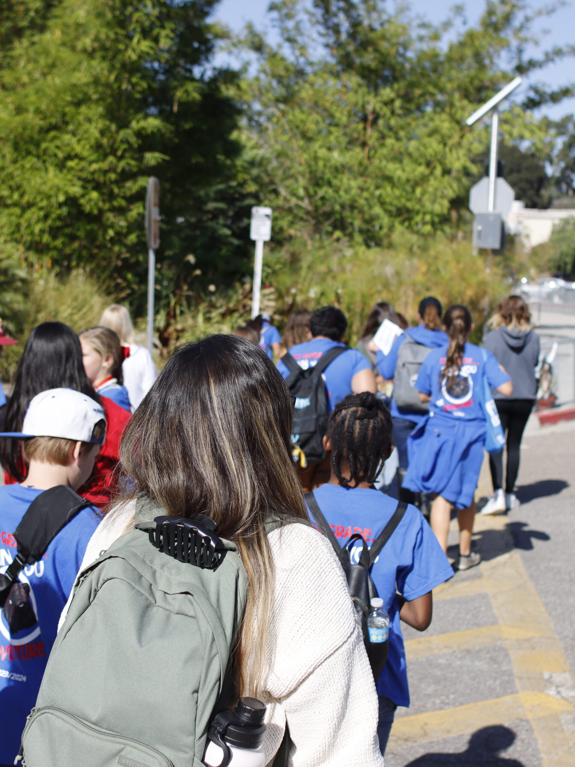 Decorative photo of a group tour walking around campus.