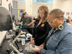 Two women in a Water Technology class working with the equipment.