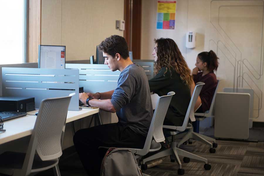 Three students in the Fallbrook computer lab.