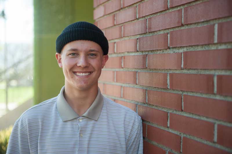 Smiling graduate.