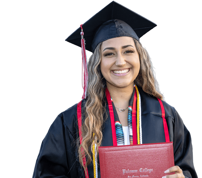Smiling Palomar College graduate holding a diploma cover.